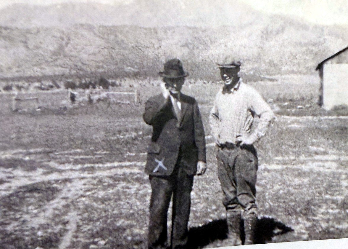Horace C. Holbrook on the family farm in Lehi, Utah in 1932, with the Lehi ridgeline behind him